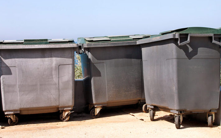 Large Garbage Containers, Trash Dumpsters And Bins Standing In R